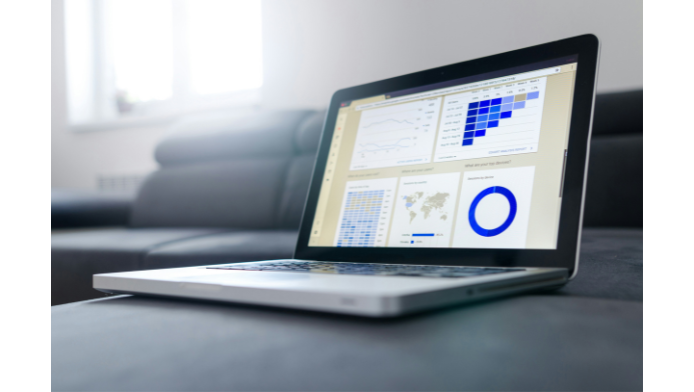 Laptop screen with charts and graphs